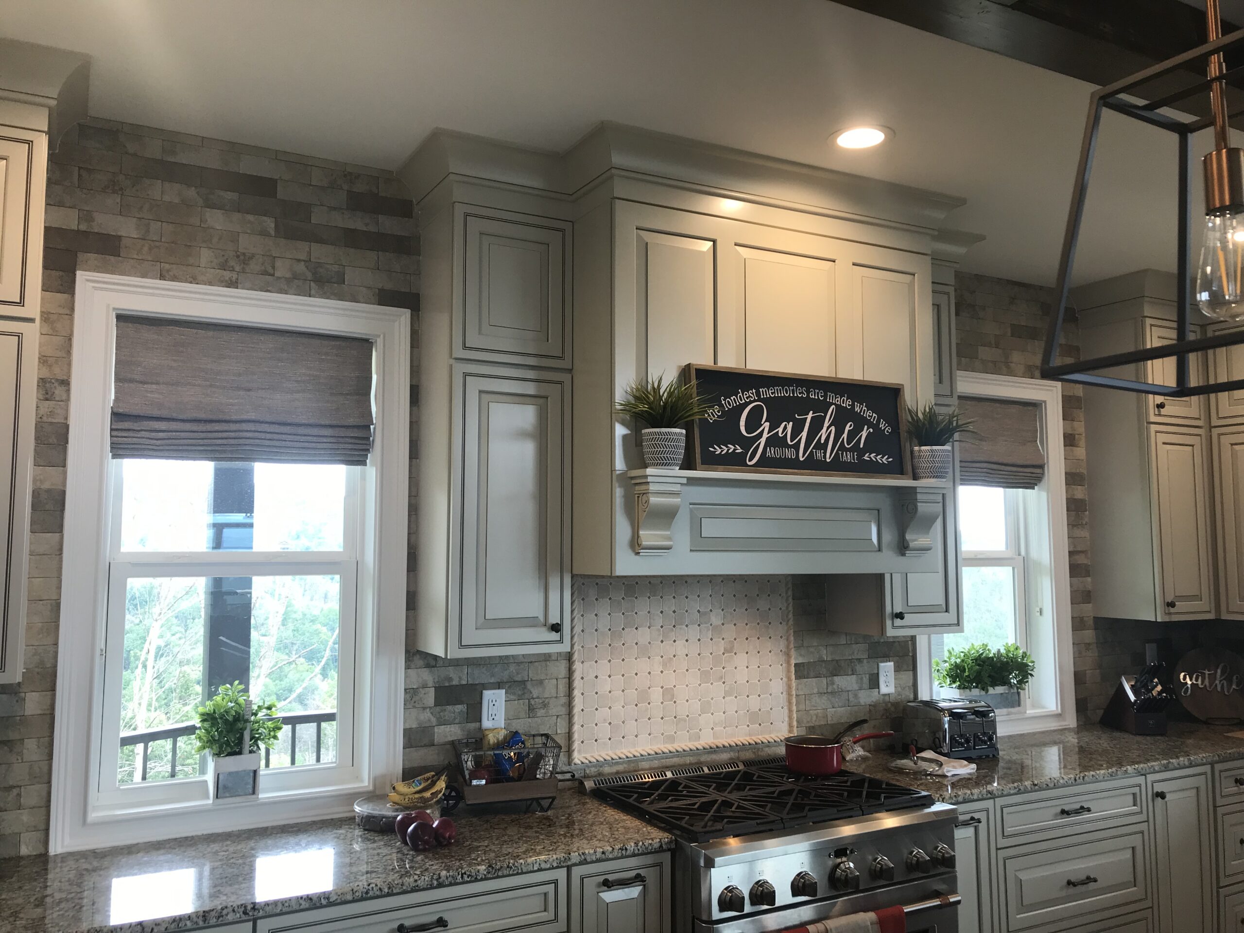 Woven wood Roman shades in a farmhouse kitchen