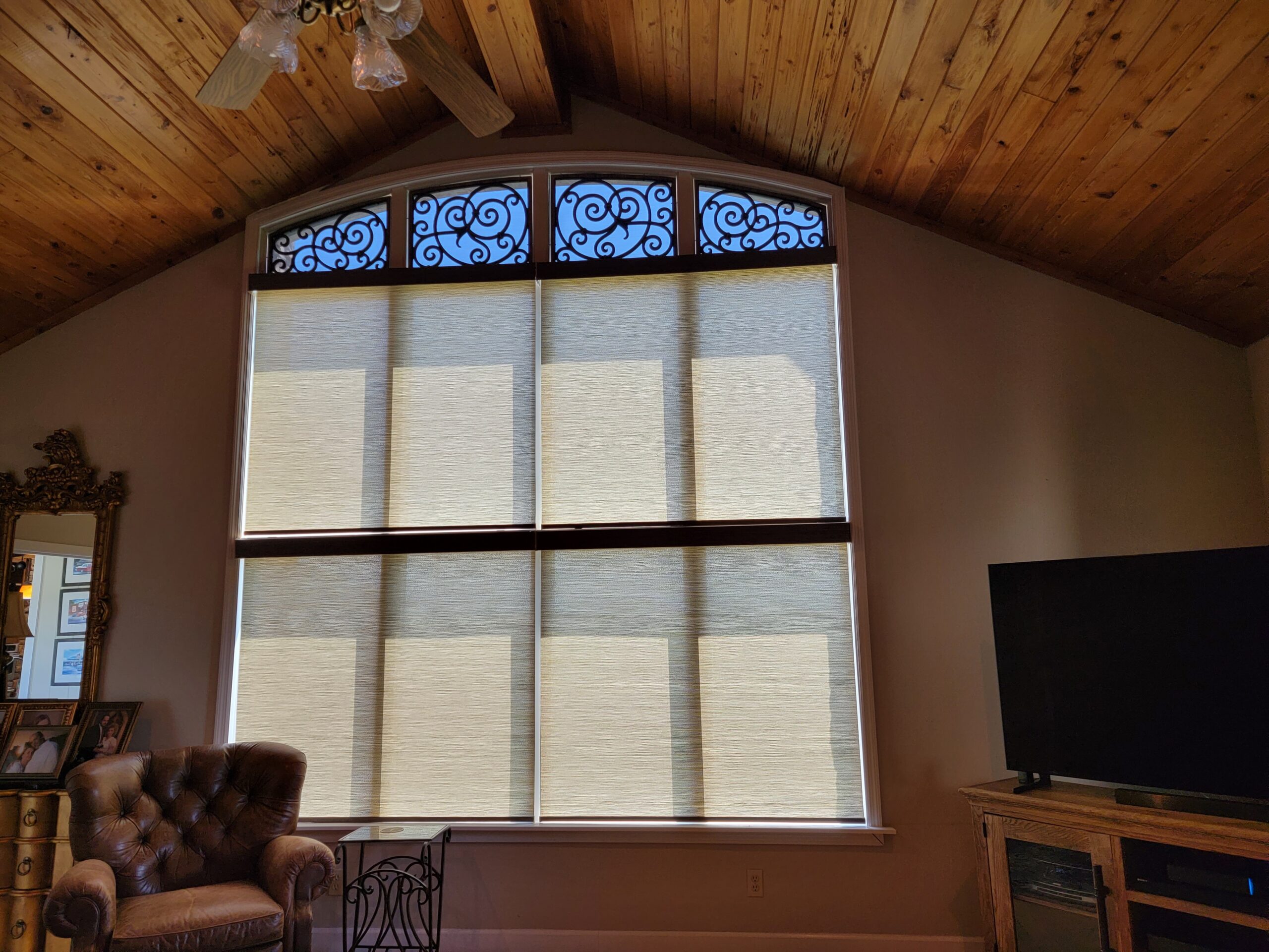 Motorized cellular shades on a tall arched living room window, Sevierville TN